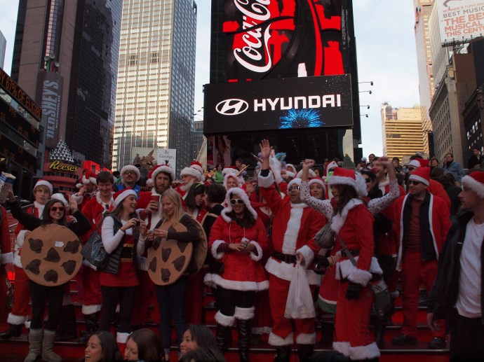 Santas on the TKTS steps in Times Square, along with some tourists who annoyingly insisted on crowding into the frame.