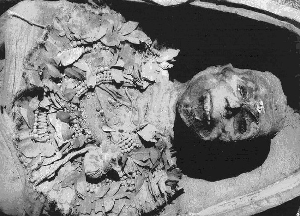 A postcard of King Tut's mummy from inside his tomb at the Valley of the Kings.