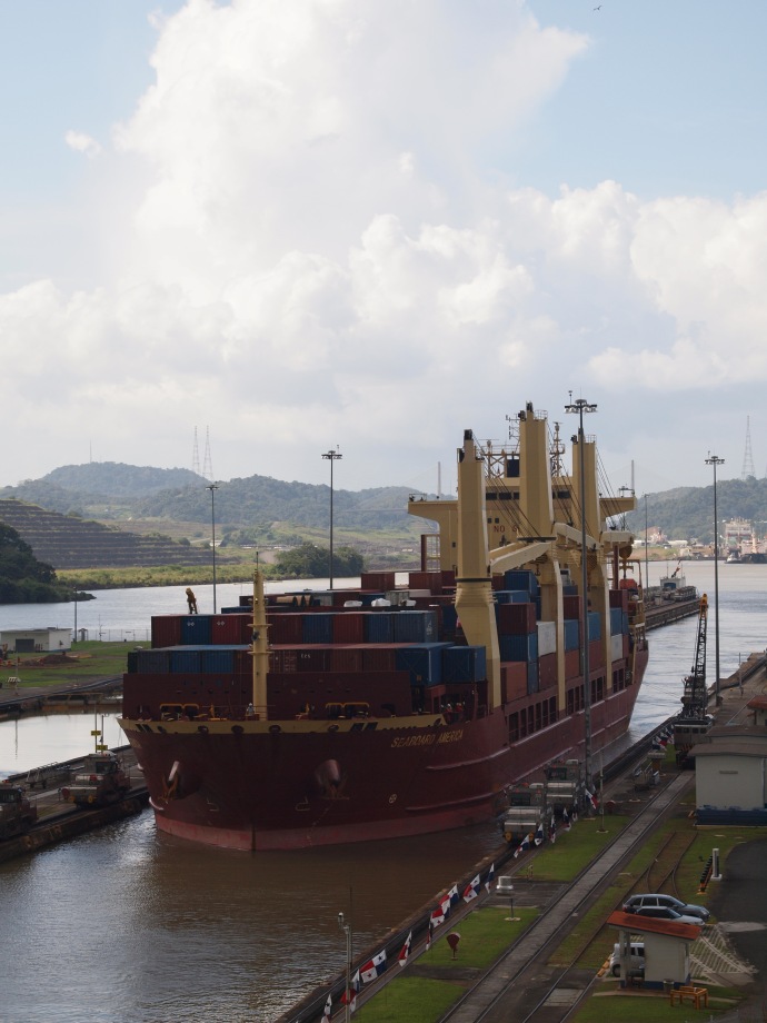 The container ship, with its colourful cargo, pulls into the Miraflores locks.