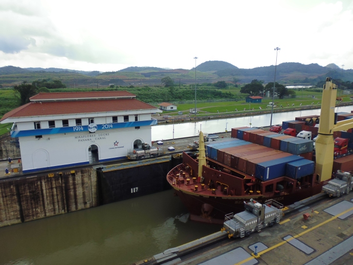 he container ship waits in one segment of the Miraflores Locks while the water level is lowered.