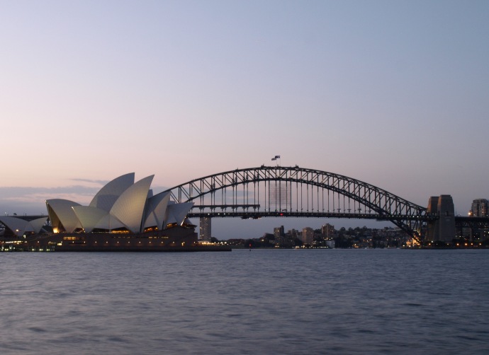 The Sydney Opera House and Harbour Bridge at dusk.