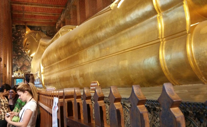 The Reclining Buddha at the Wat Pho temple in Bangkok is about 50 feet high and 150 feet long, and is covered in gold leaf.
