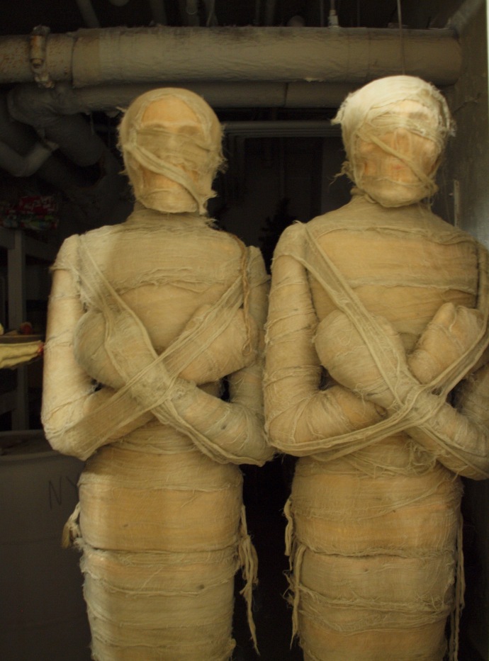 These mummies being stored in the basement are props for the hotel's annual Halloween celebration. OR ARE THEY???