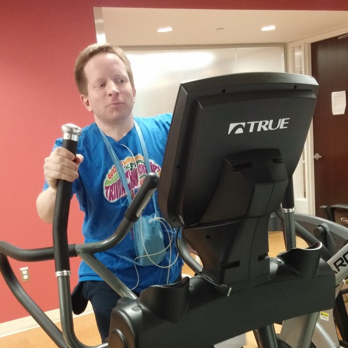 Me on an elliptical machine during one of my cardiac rehab sessions.