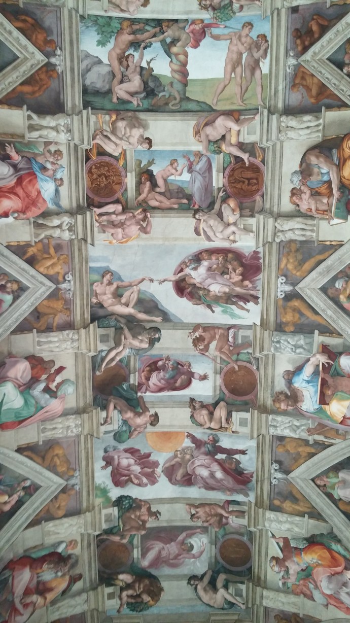 A view of the Sistine Chapel ceiling in the Vatican Museums, featuring the iconic panel entitled "The Creation of Adam."