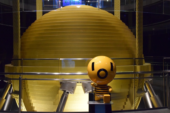 The wind damper, with a mascot called the "Damper Baby" in front of it.